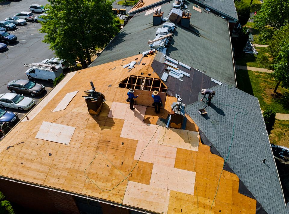 Aerial view of a completed asphalt shingle roof replacement on a residential home in Houston TX