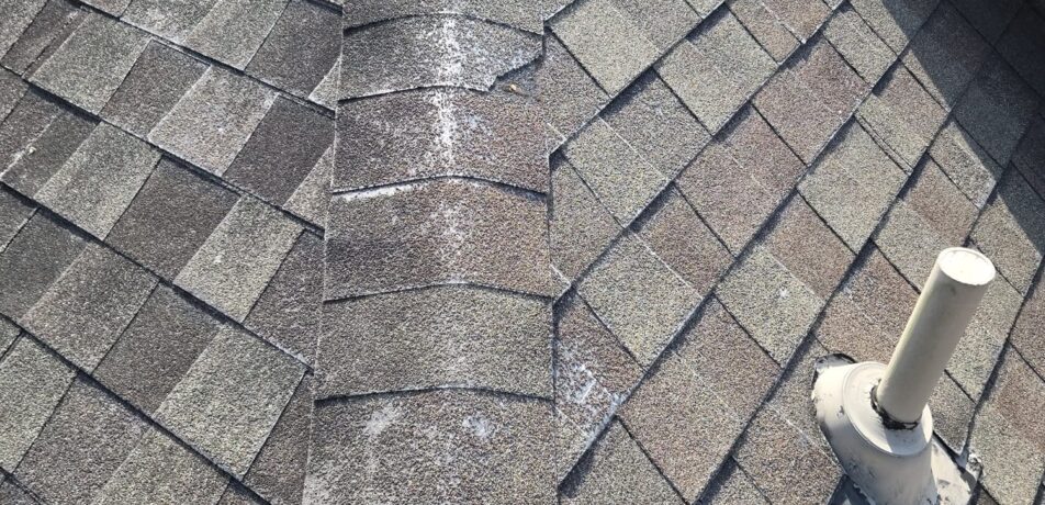 Two-story home in Katy TX with aging shingle roof before full roof replacement